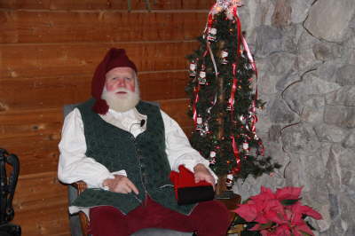 Santa sitting on a rocking chair at the Nature Center